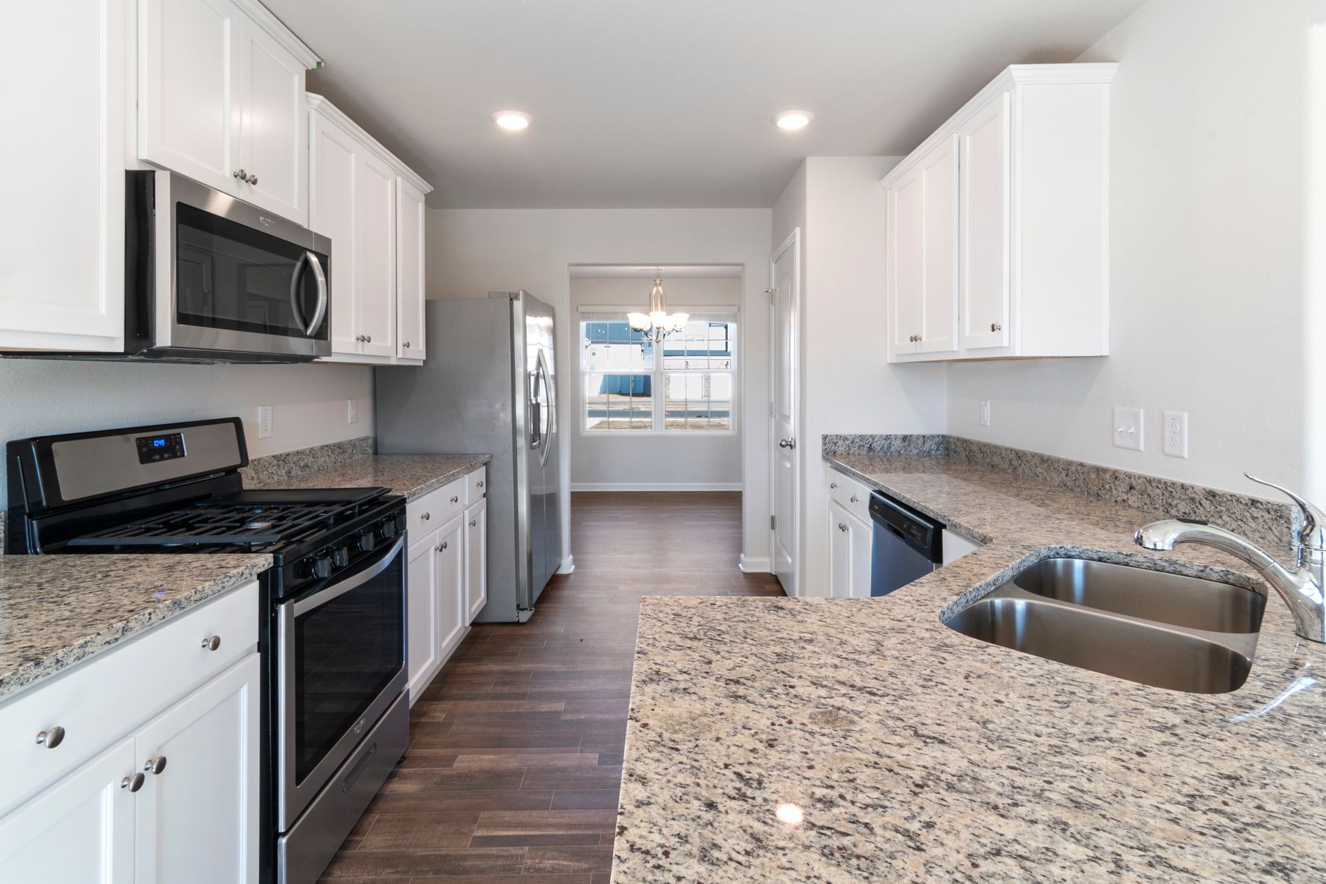 Bright and spacious kitchen featuring modern appliances and granite countertops in Austin, TX